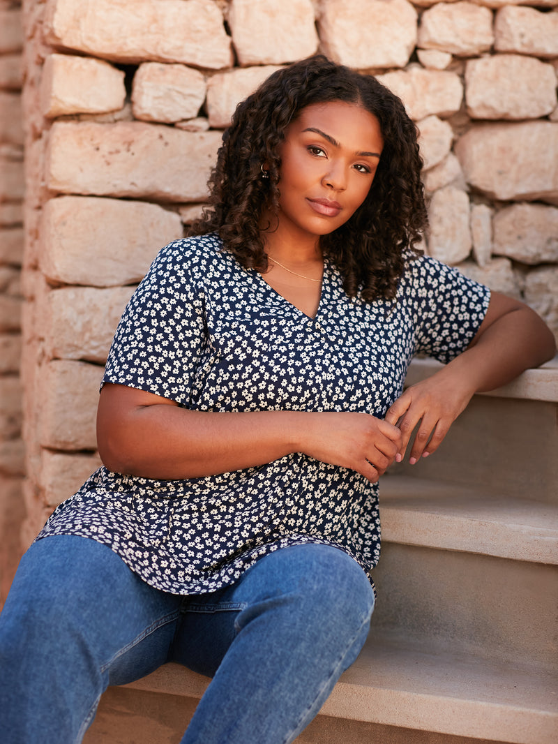 Model wears Navy Ditsy Pleat Front Top and links to tops