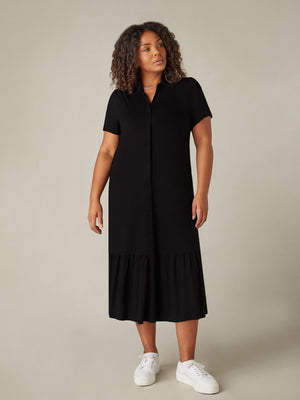 Model wears Black Jersey Tiered Midi Shirt Dress