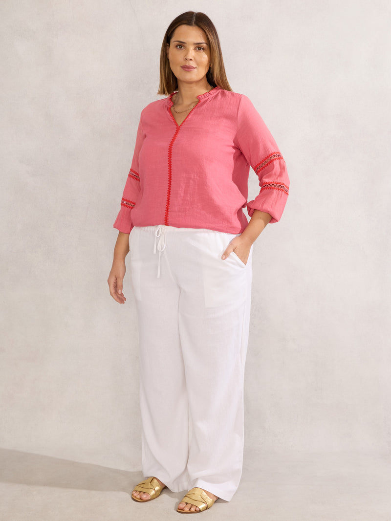 Pink Blouse With Red Trim Detail
