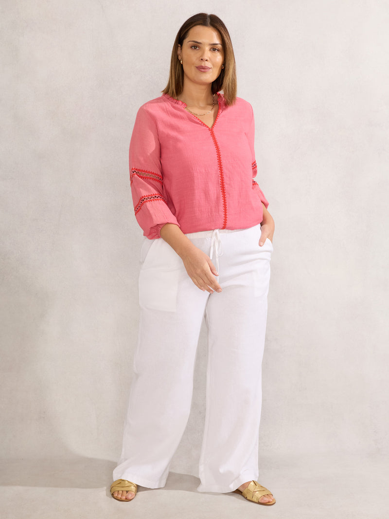Pink Blouse With Red Trim Detail