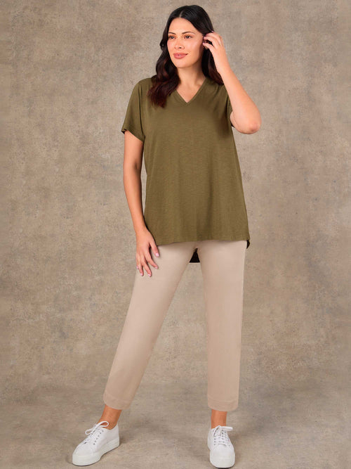Oatmeal cropped jeggings styled with khaki V-neck t-shirt