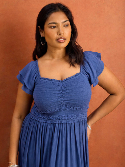 Blue smocked bodice dress with square neckline detail