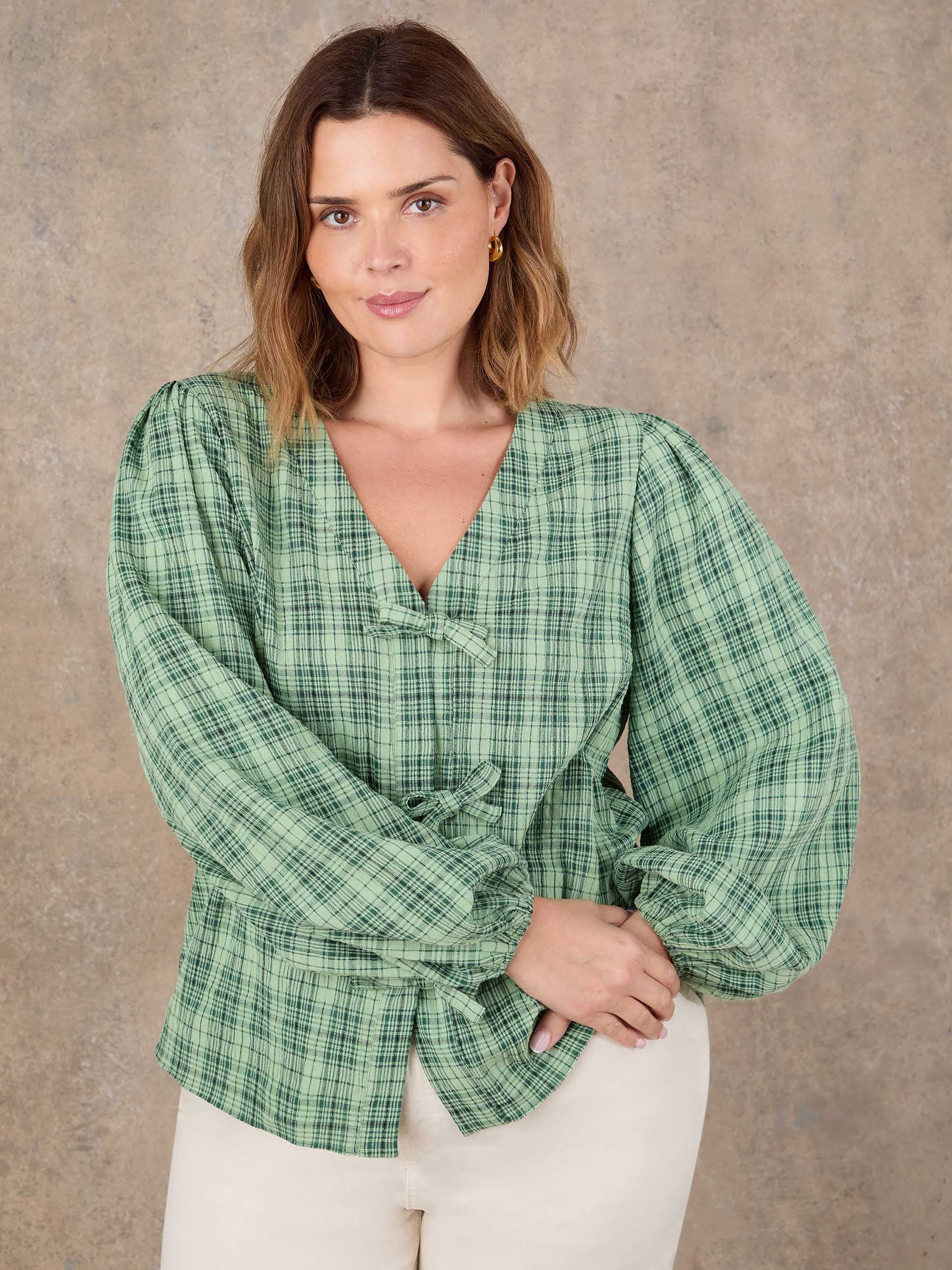 Plus size green check bow front blouse with V neckline and long sleeves
