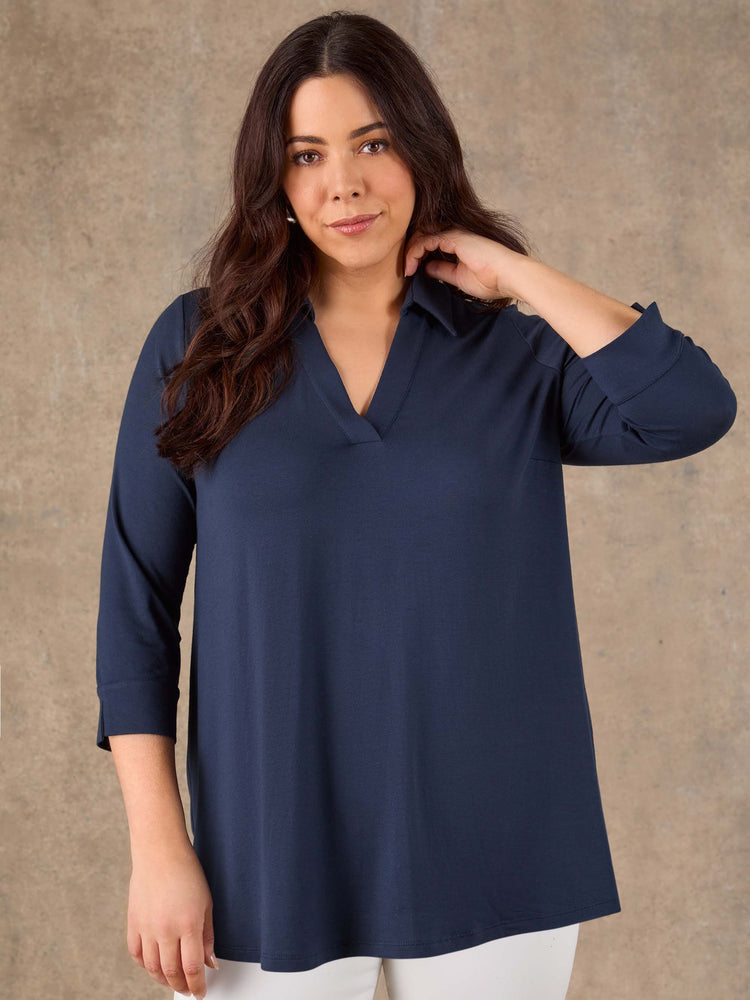Navy blue jersey collared top with V neckline and three quarter sleeves