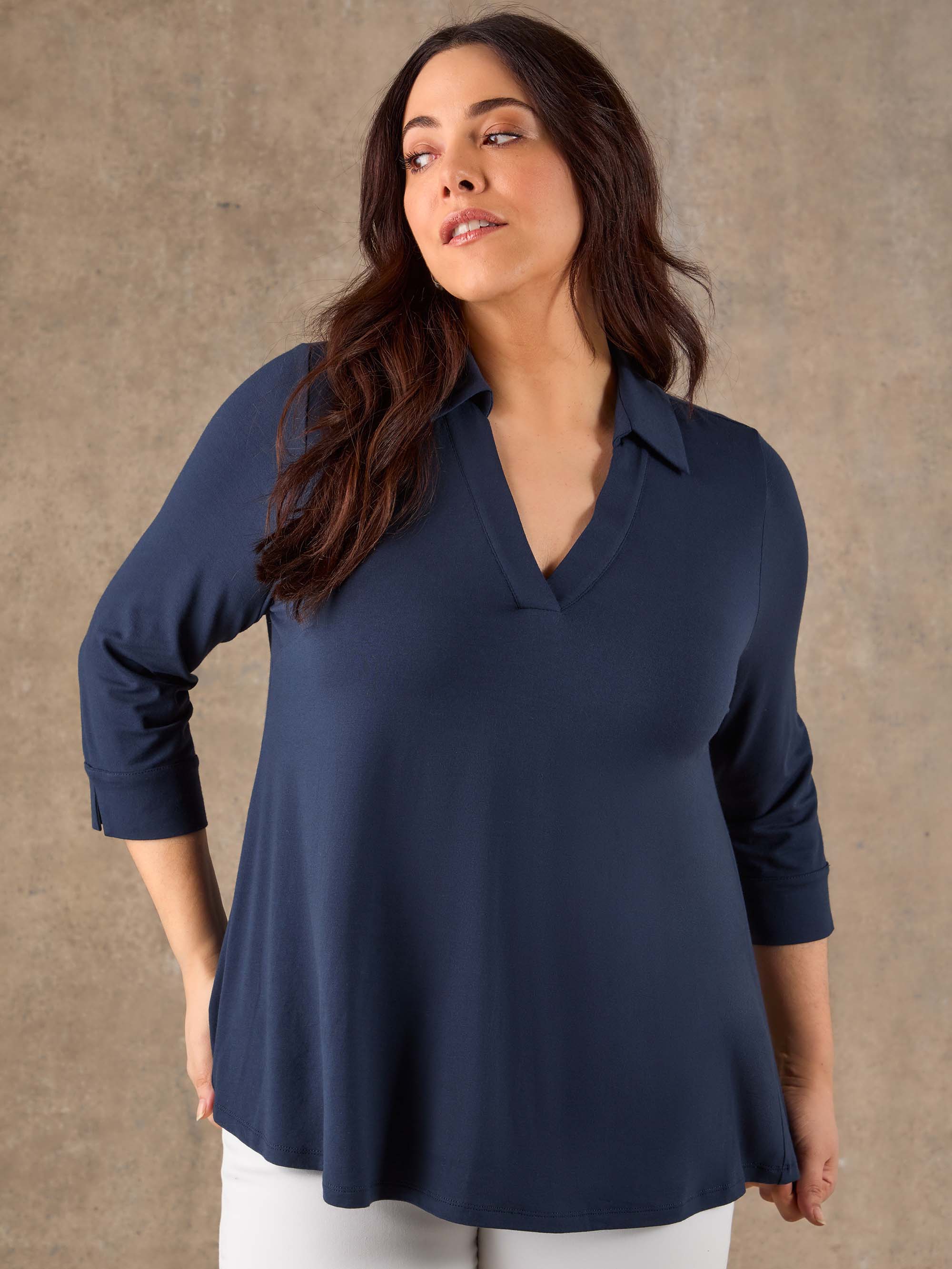 Blue stretch jersey blouse with V neck and cuffed sleeves