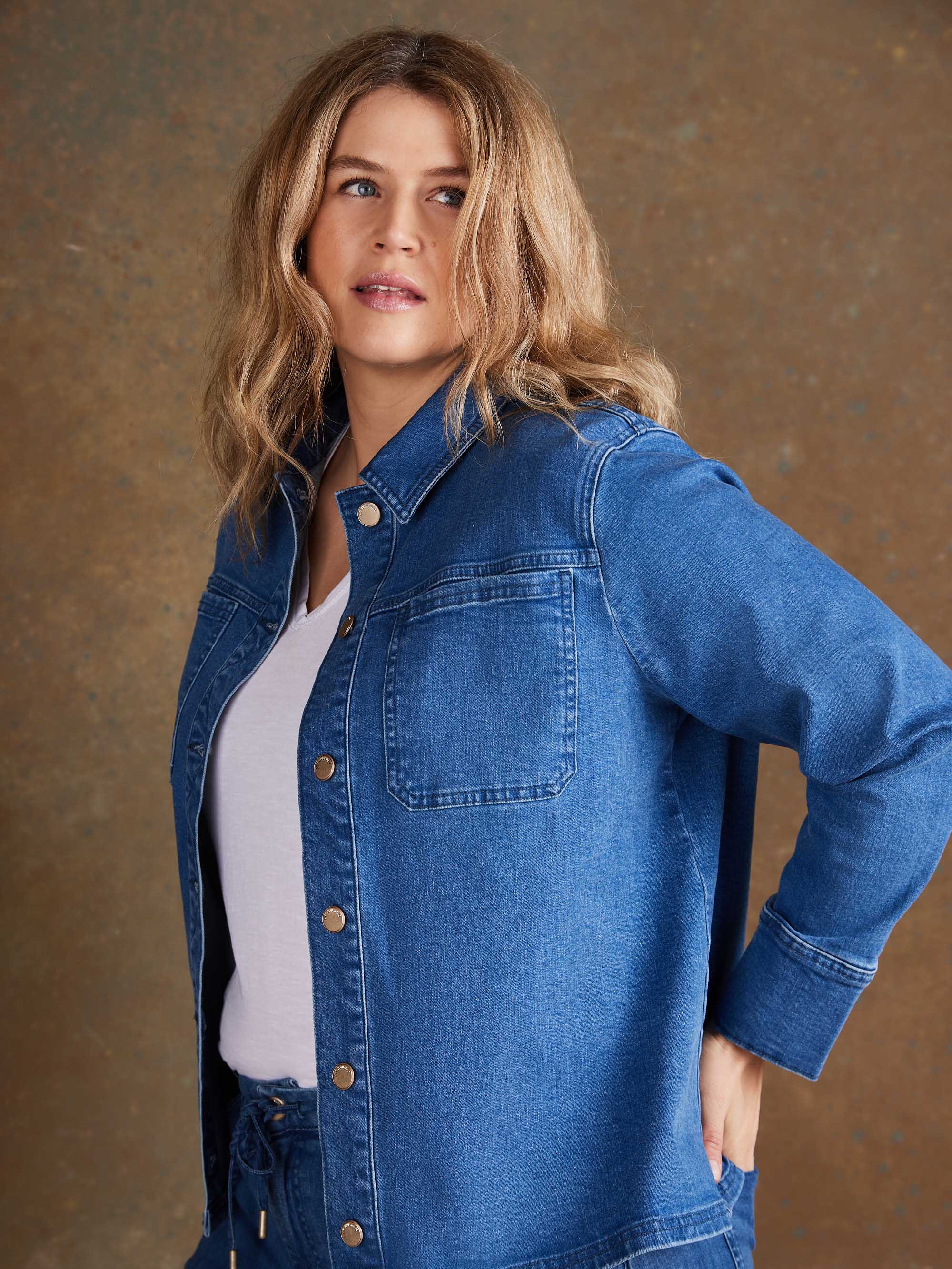 Plus size classic blue denim jacket with front buttons and structured collar