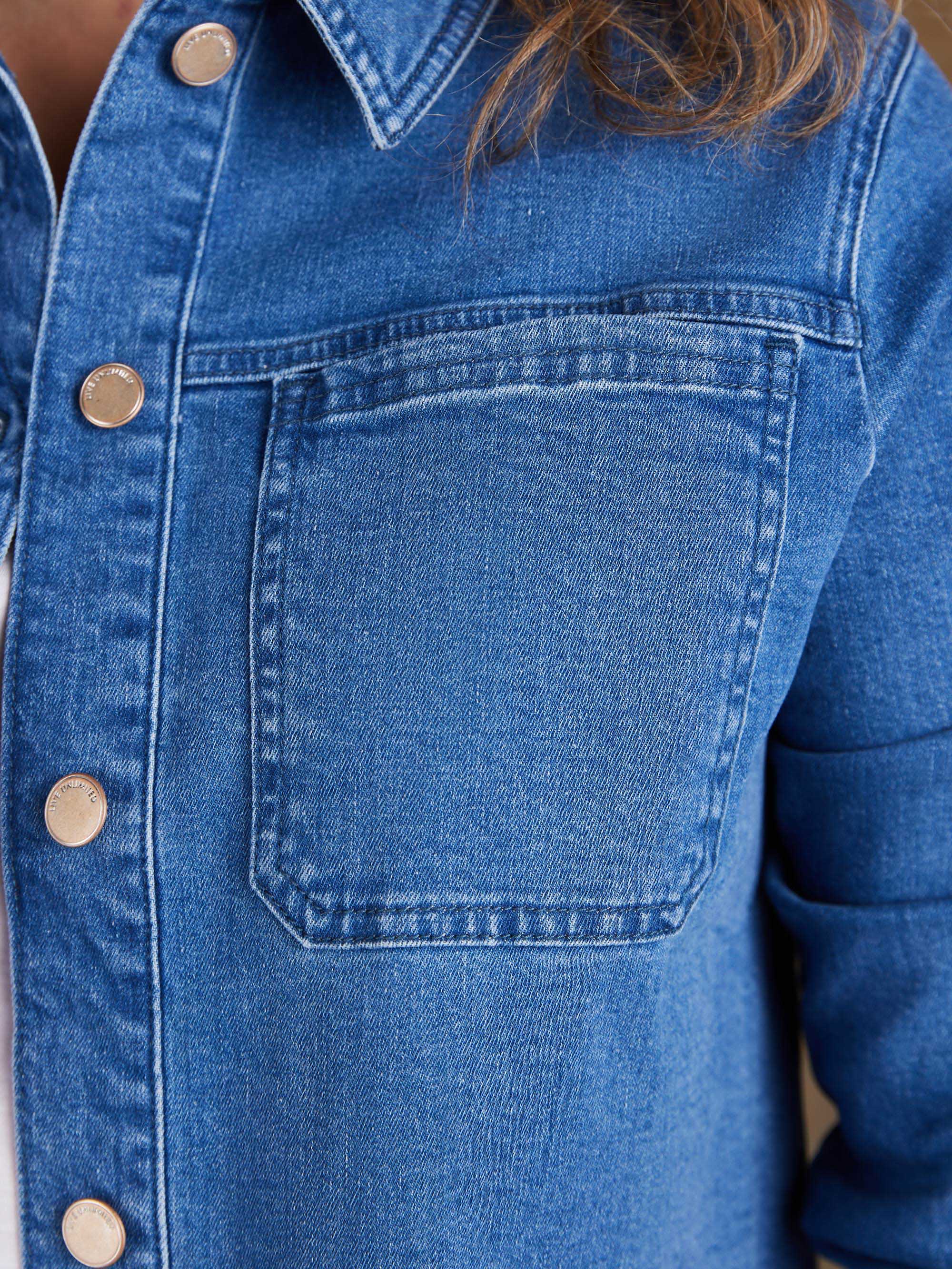 Curve fit blue denim jacket with patch pocket detail and button cuffs