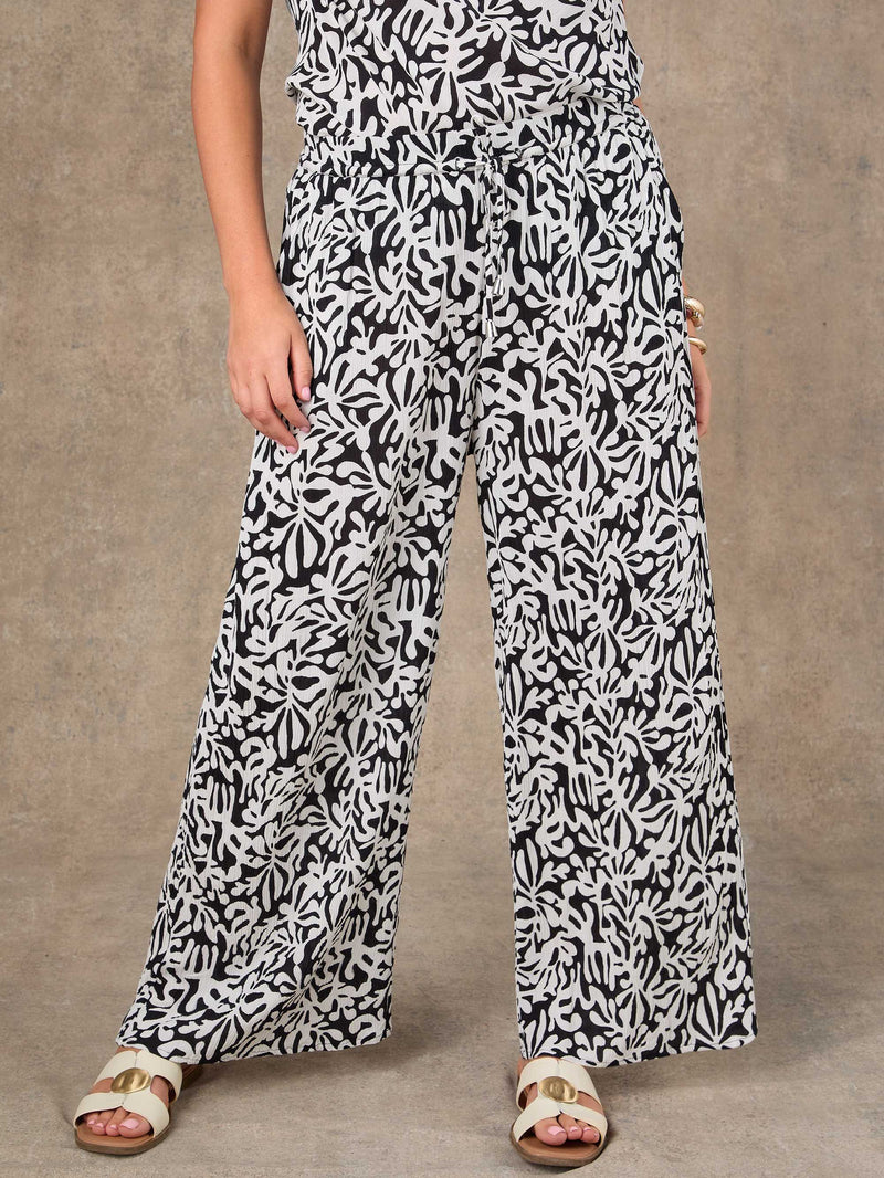 Plus size black and white mono print wide leg trousers