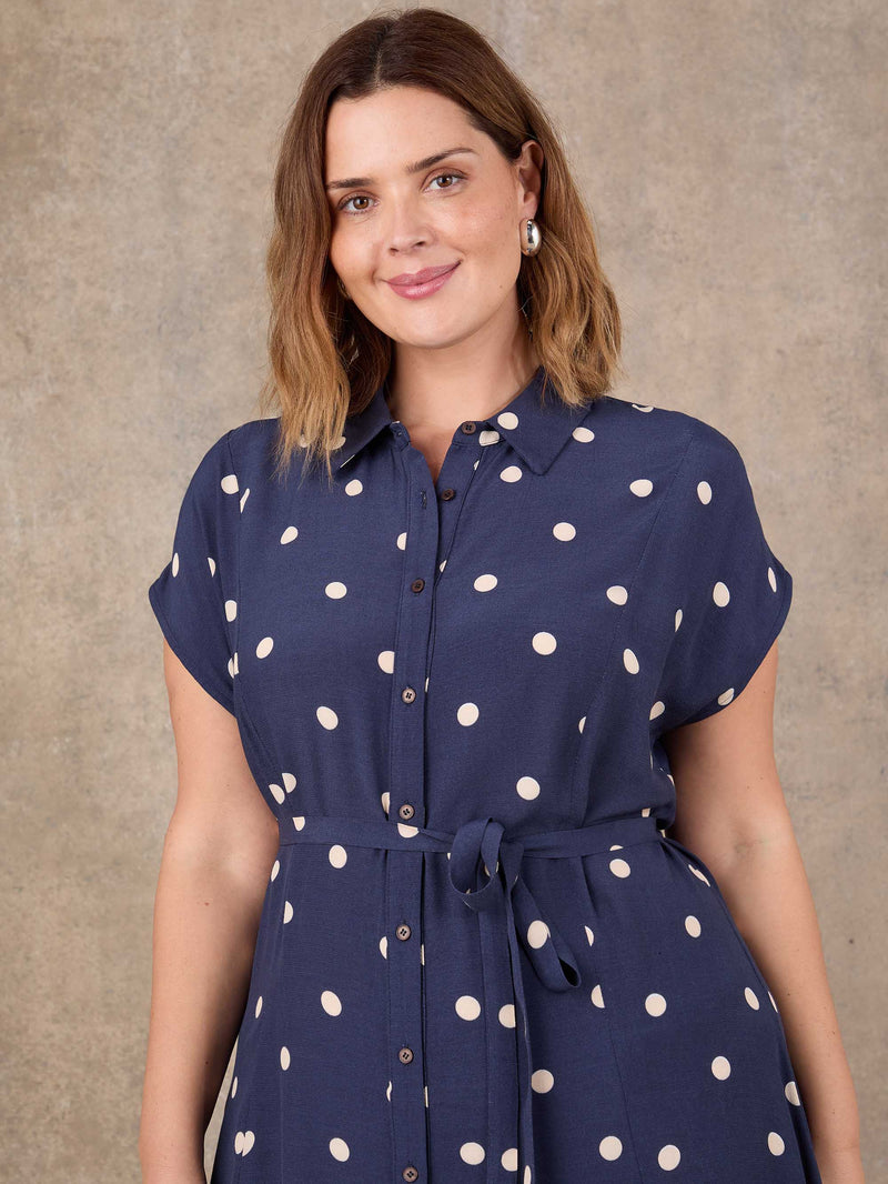 Plus size navy polka dot midaxi shirt dress with short sleeves and waist tie detail