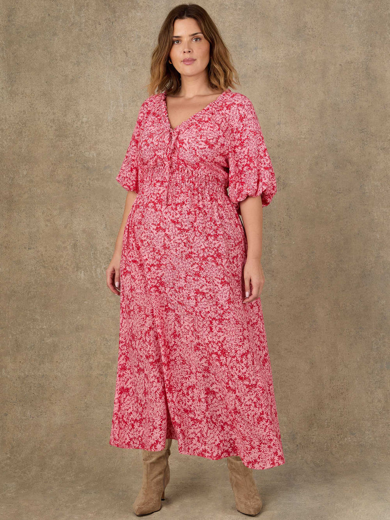 Pink floral midi dress with puff sleeves and gathered waist