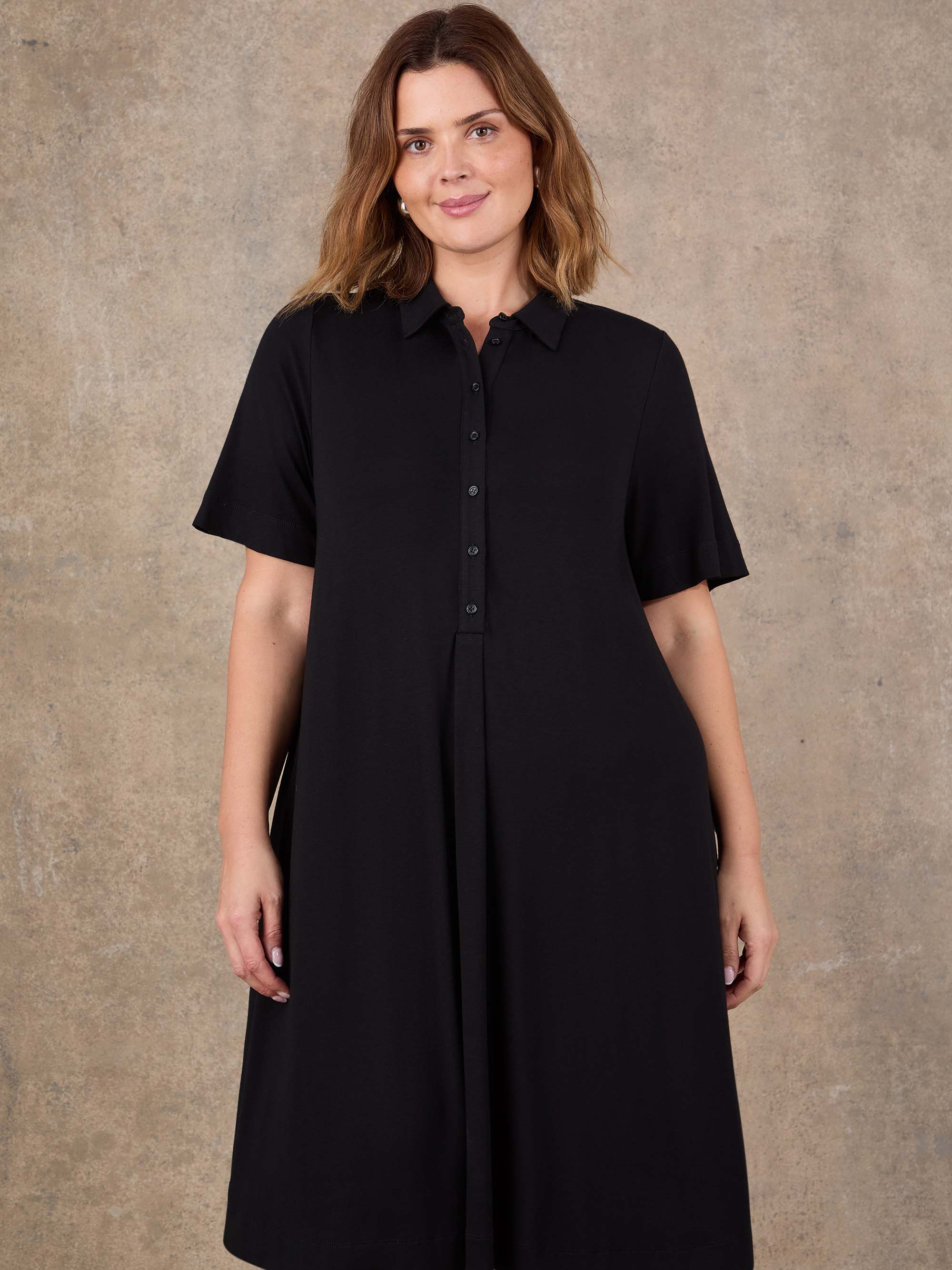 Black short sleeve jersey dress with relaxed fit silhouette