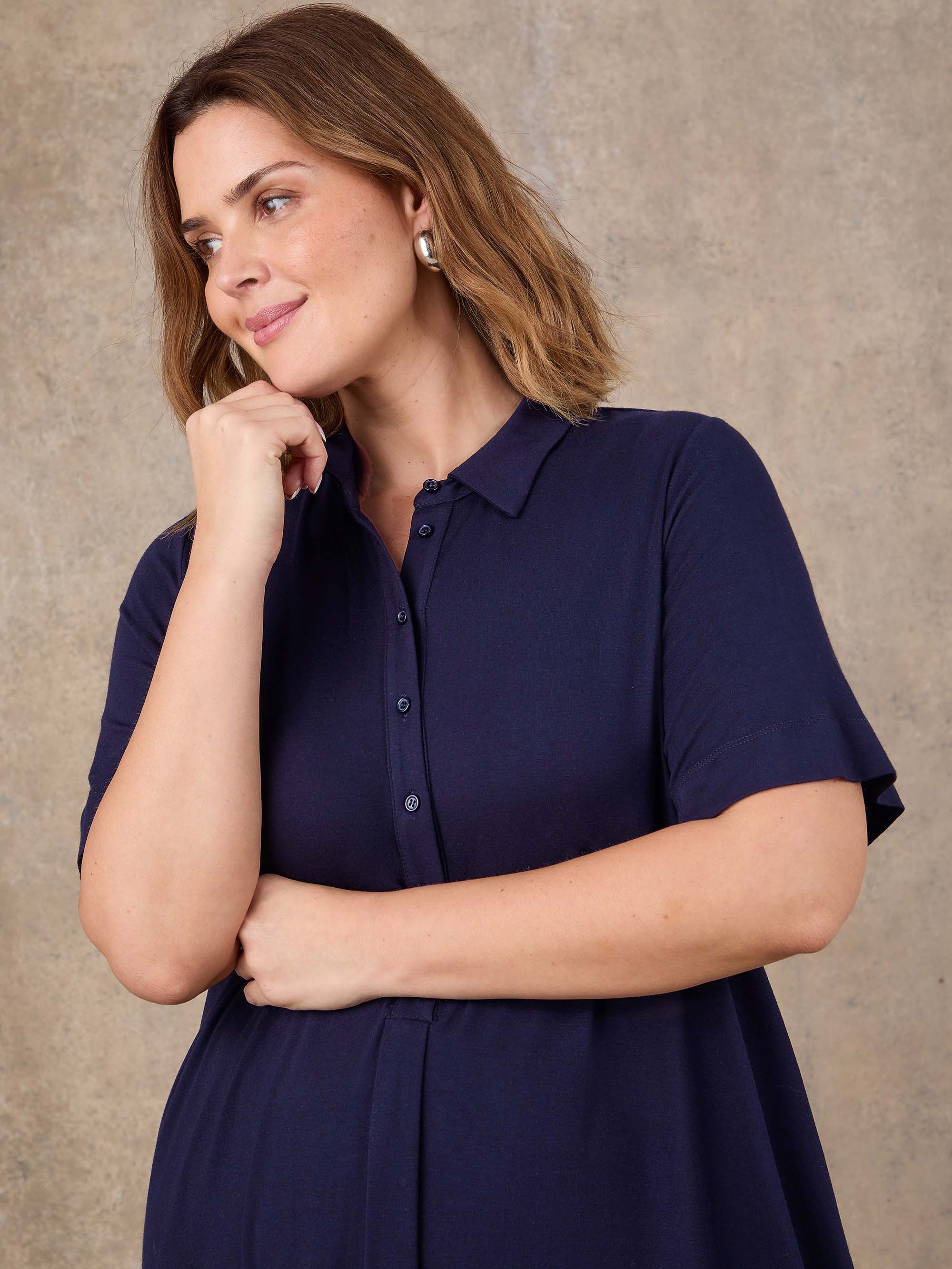 Navy short sleeve jersey dress with relaxed fit silhouette