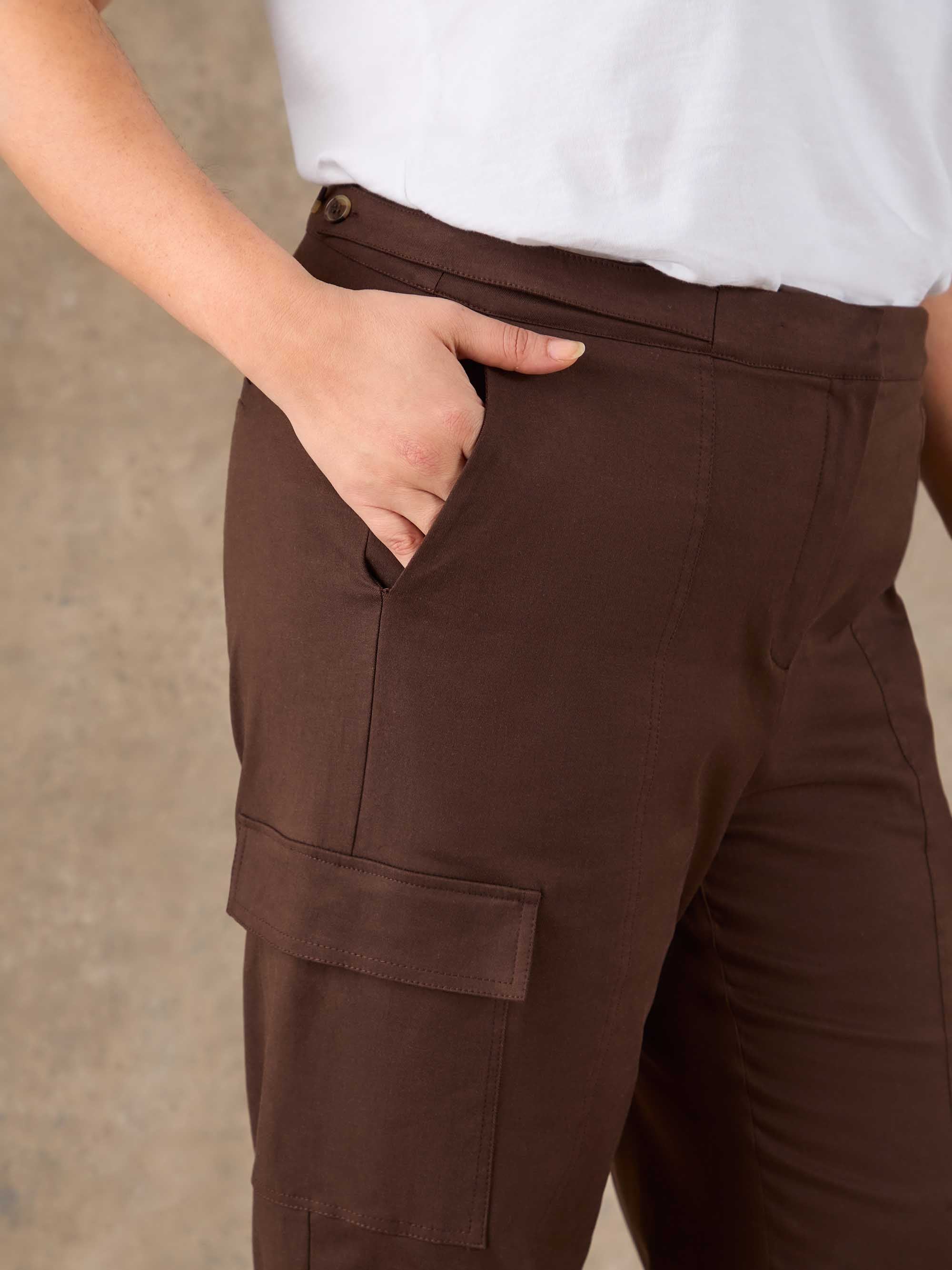 Plus size brown utility trousers with fly front fastening and relaxed straight leg