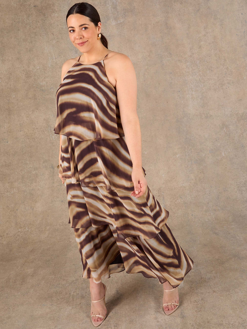 Plus size brown printed halter maxi dress with flowing silhouette and invisible zip