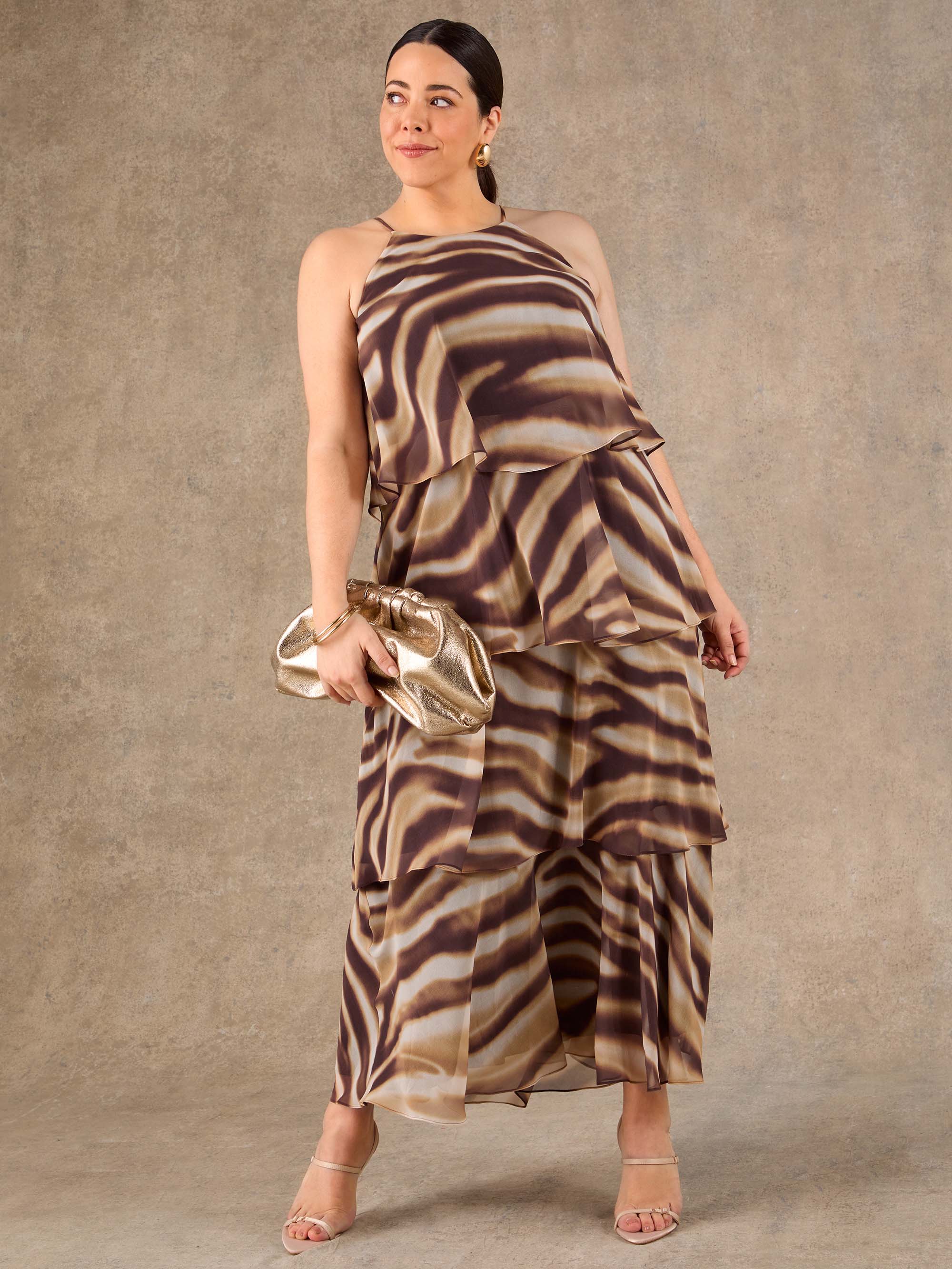 Plus size brown tiered halter neck maxi dress designed for weddings and evening events