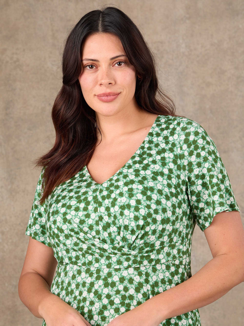 Plus size green ditsy twist front jersey dress close-up