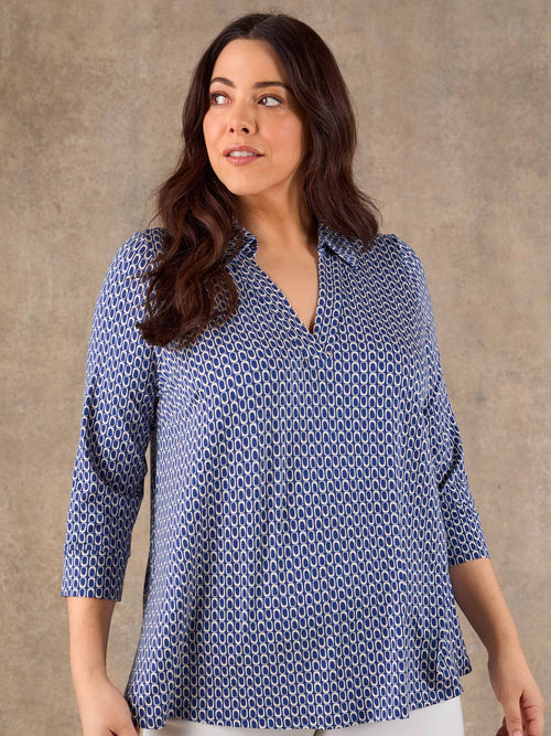 Blue geometric print jersey collared top with V neckline