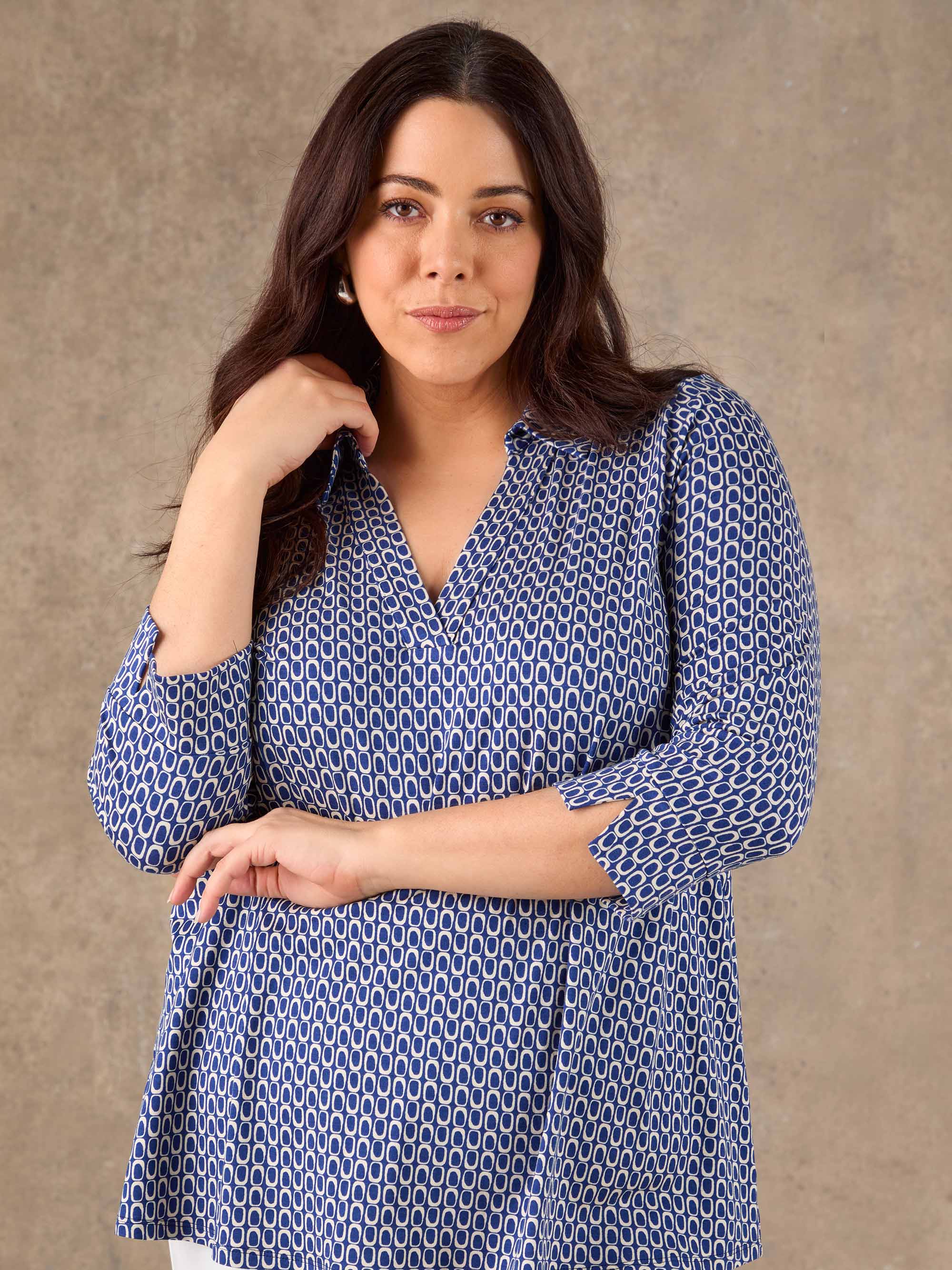 Blue geo print short sleeve jersey blouse with button front