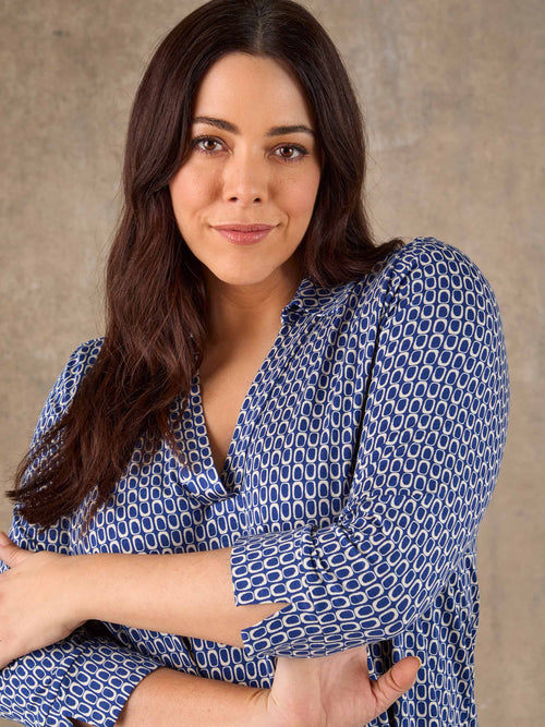 Blue geometric print V neck jersey top with short sleeves