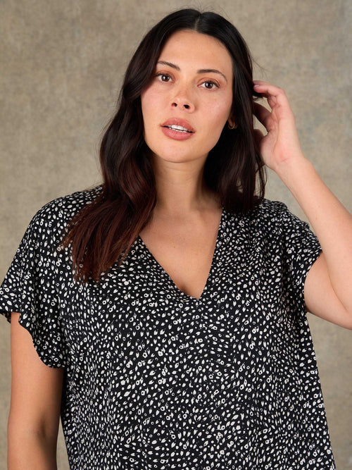 Plus size black ditsy print V neck top front view