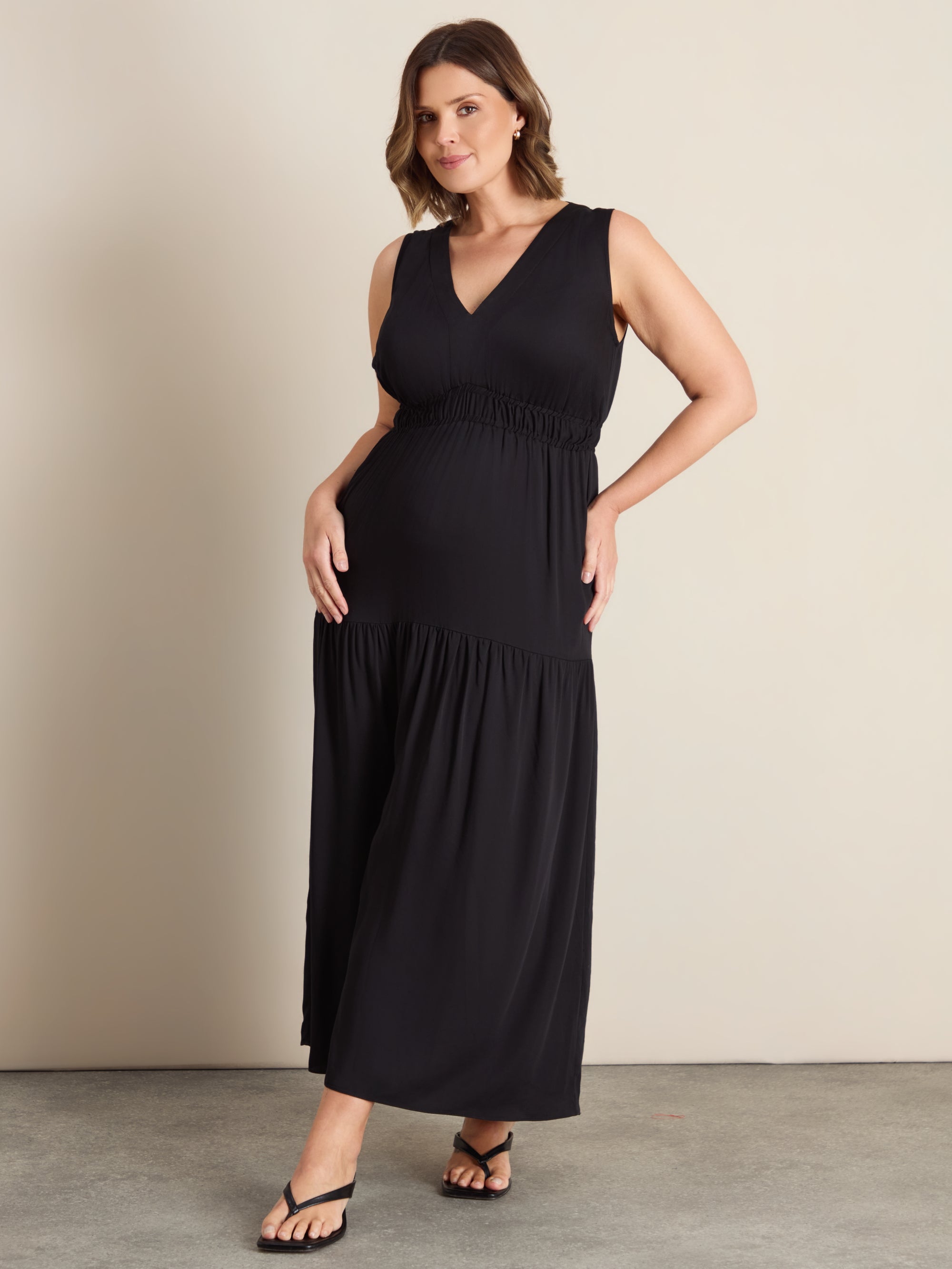 Curve shirred tier maxi dress with a V-neckline, elasticated bodice, drop waist and flowing gathered skirt.