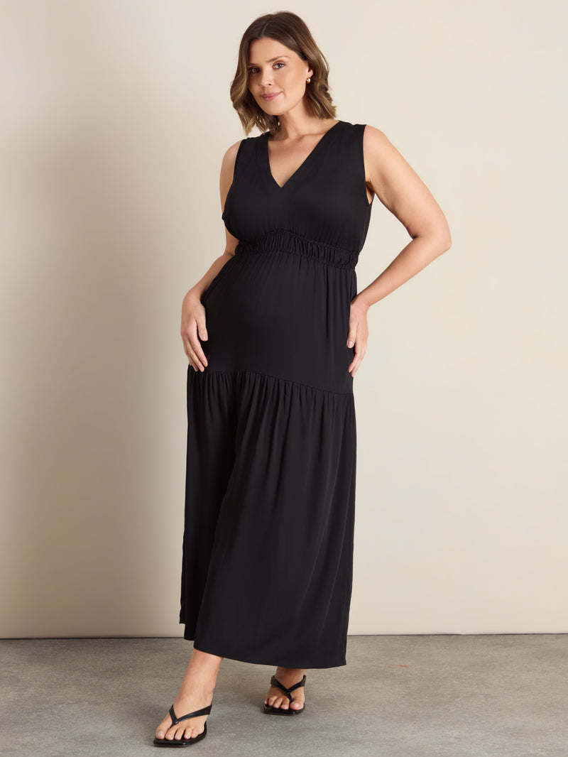 Curve shirred tier maxi dress with a V-neckline, elasticated bodice, drop waist and flowing gathered skirt.