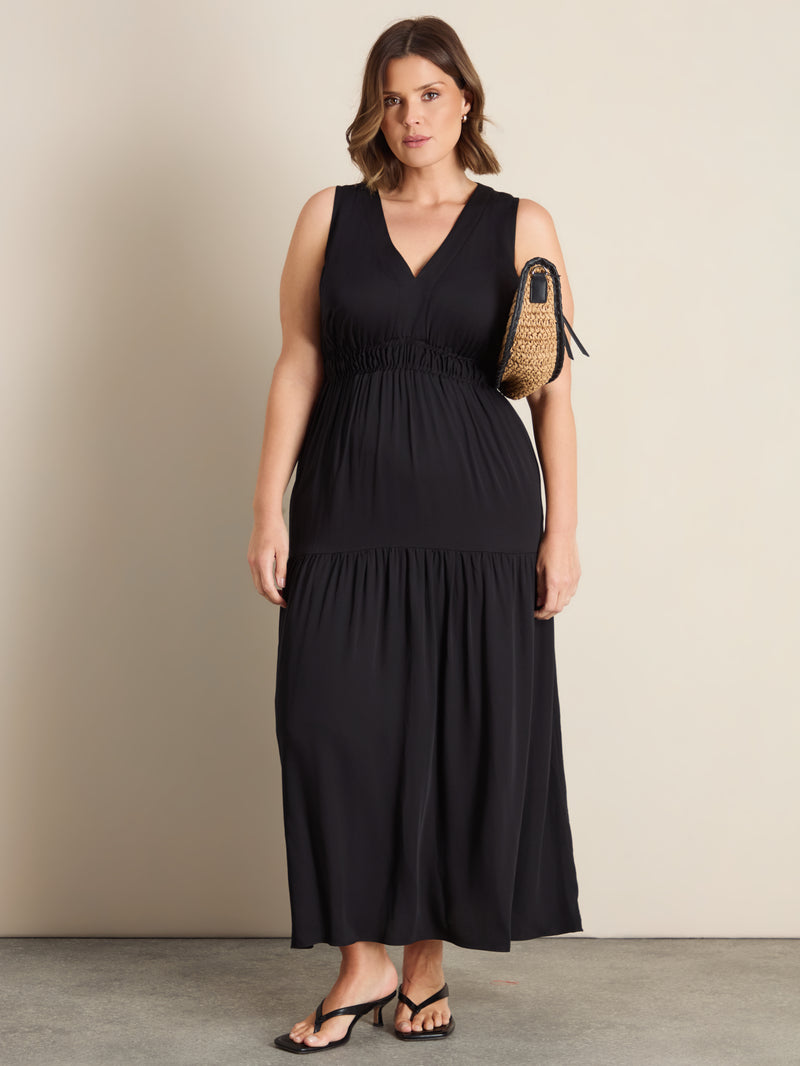 Curve shirred tier maxi dress with a V-neckline, elasticated bodice, drop waist and flowing gathered skirt.