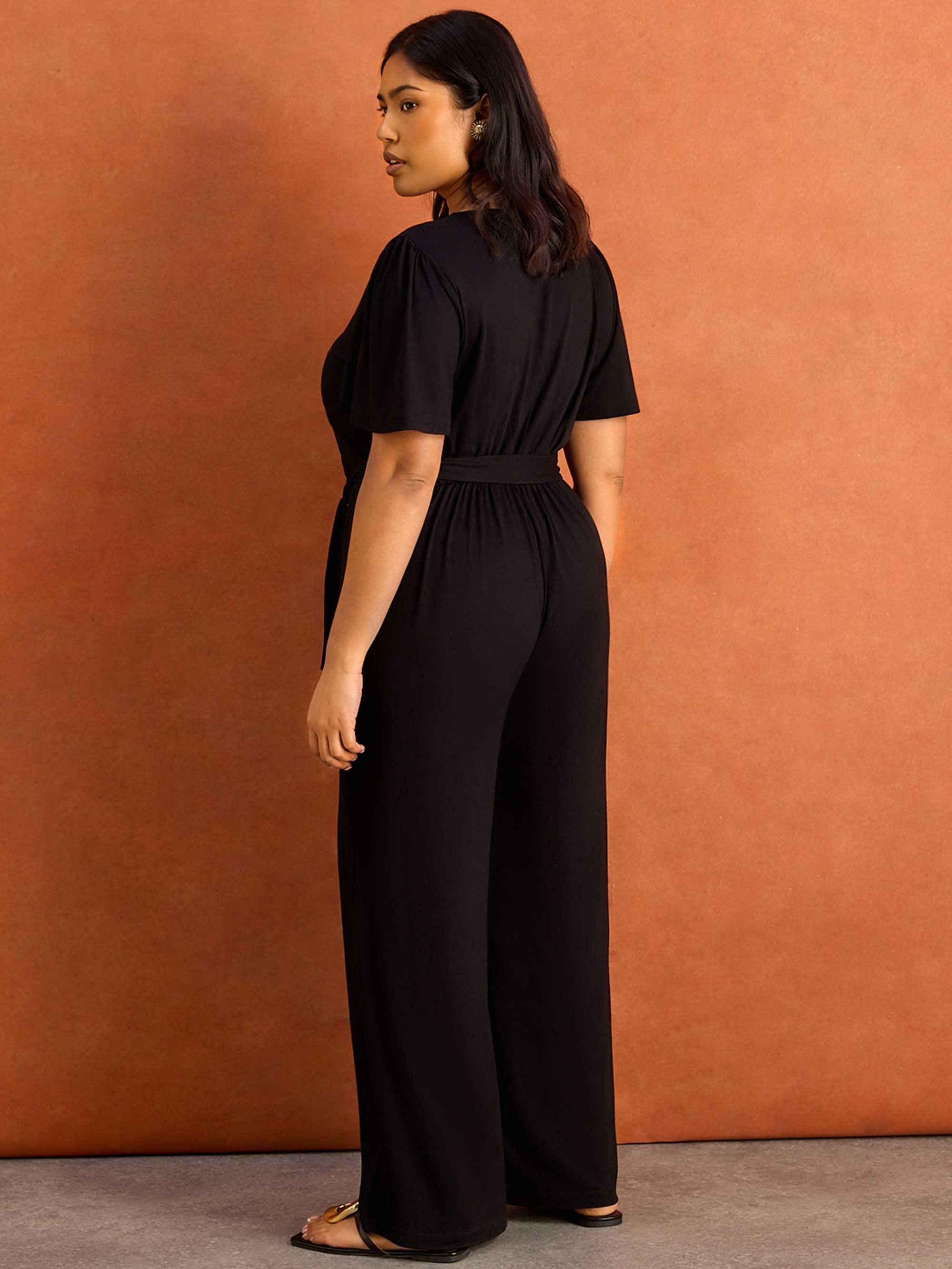Black V Neck Wrap Flutter Sleeve Jersey Jumpsuit