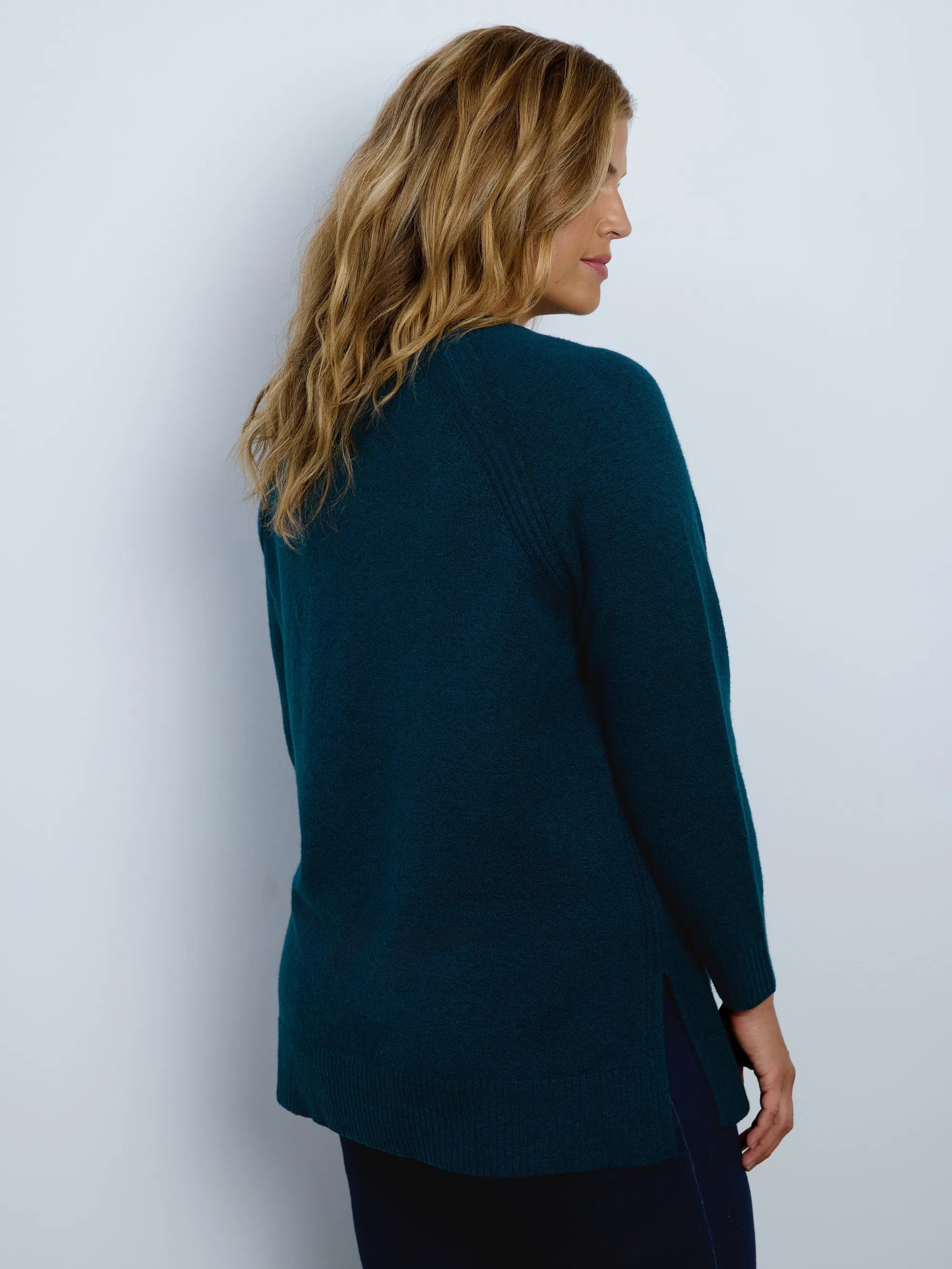 Deep teal green crew neck longline knitted jumper with long sleeves and a relaxed fit.