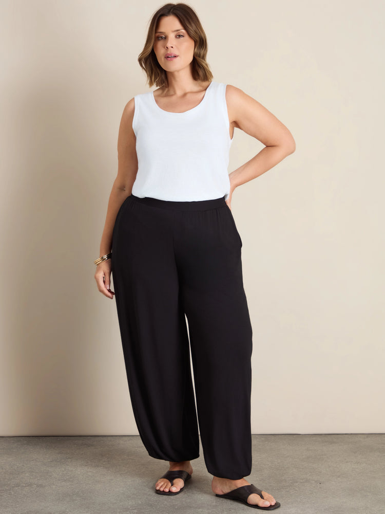 Plus size black jersey balloon leg trousers with elasticated cuffs and pockets