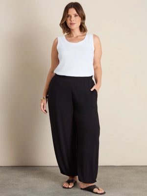Plus size black jersey balloon leg trousers with elasticated cuffs and pockets