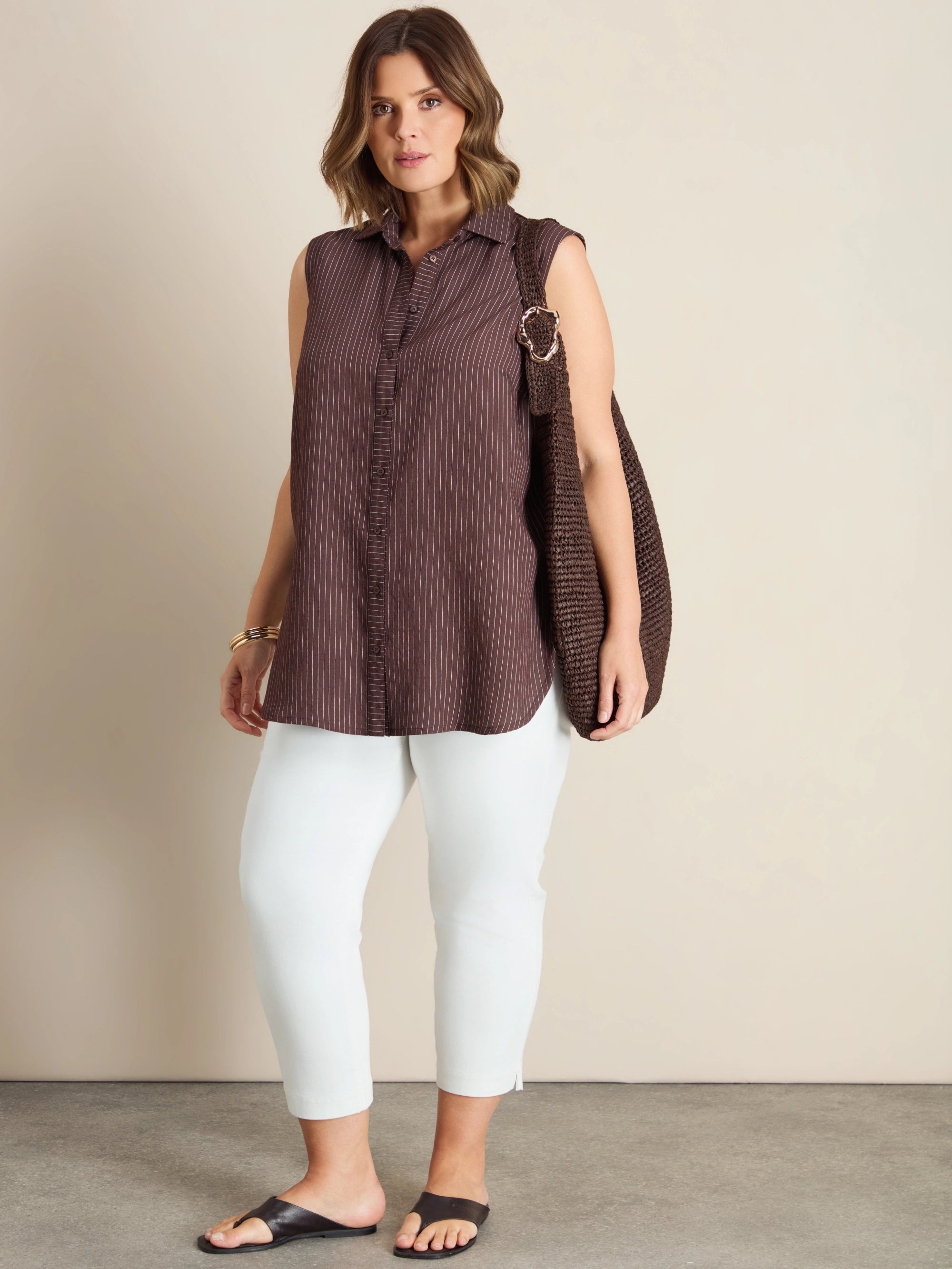 Plus size brown striped sleeveless shirt with collar and button-through front