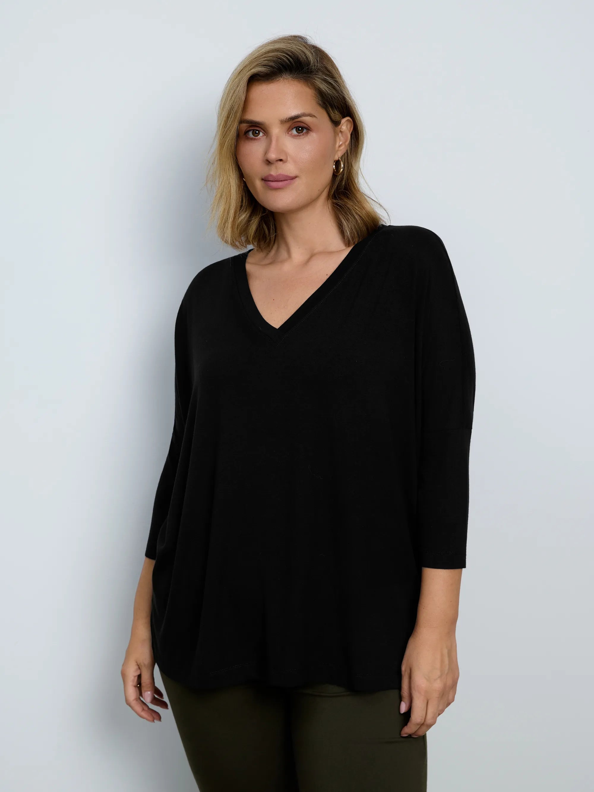 Plus size black jersey V-neck top