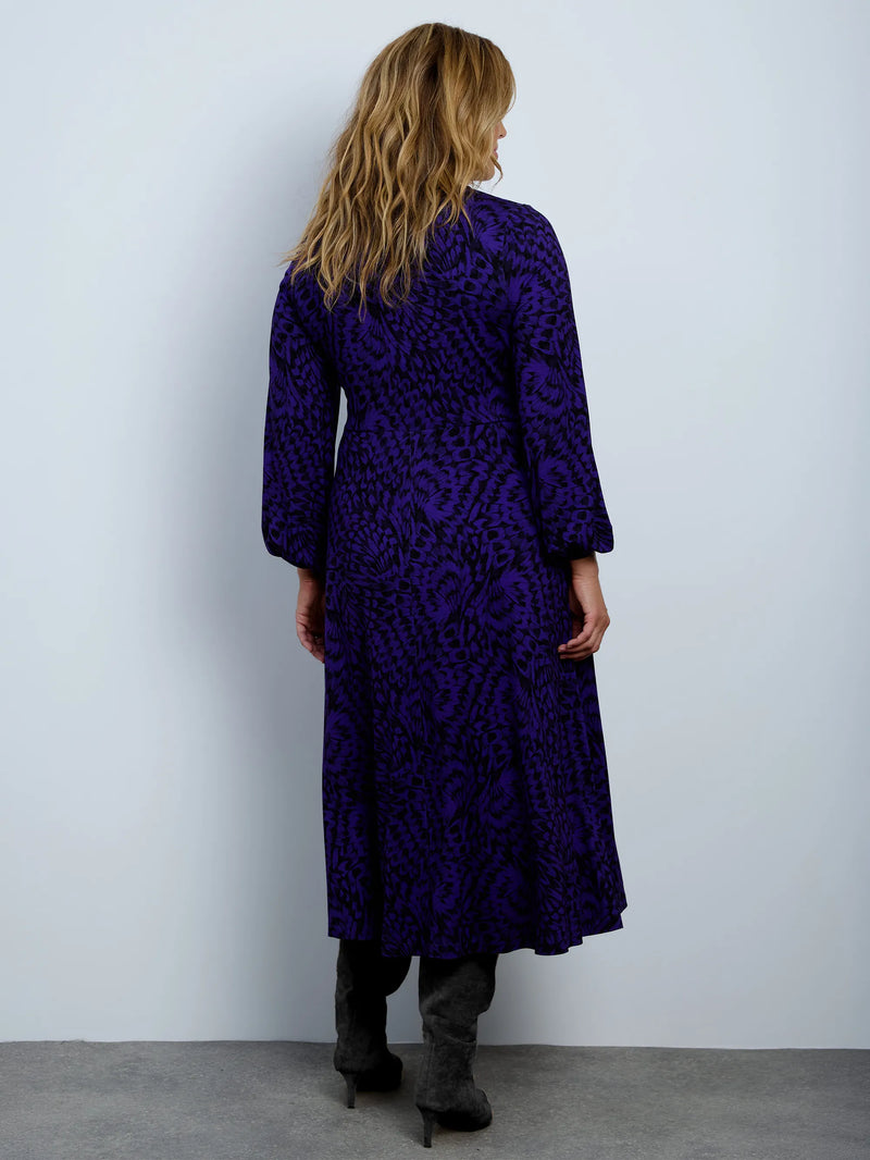 Purple abstract print jersey wrap midi dress with long sleeves.