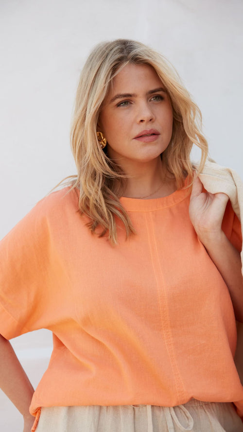 Model wears Orange Linen Mix Round Neck Top